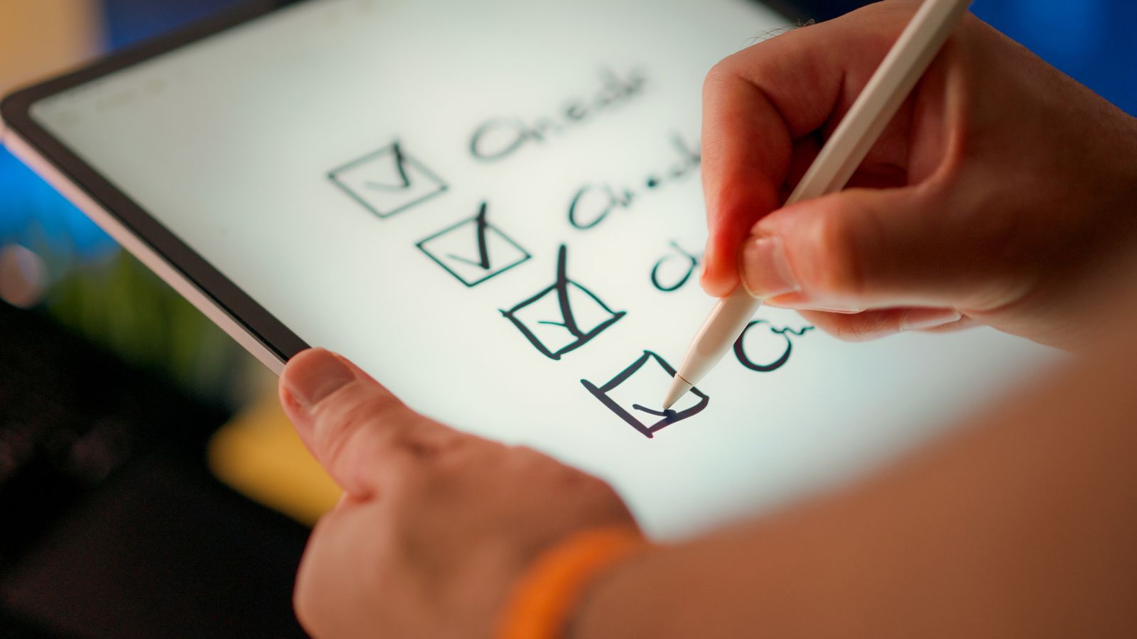 A digital checklist being marked off on a tablet with a stylus
